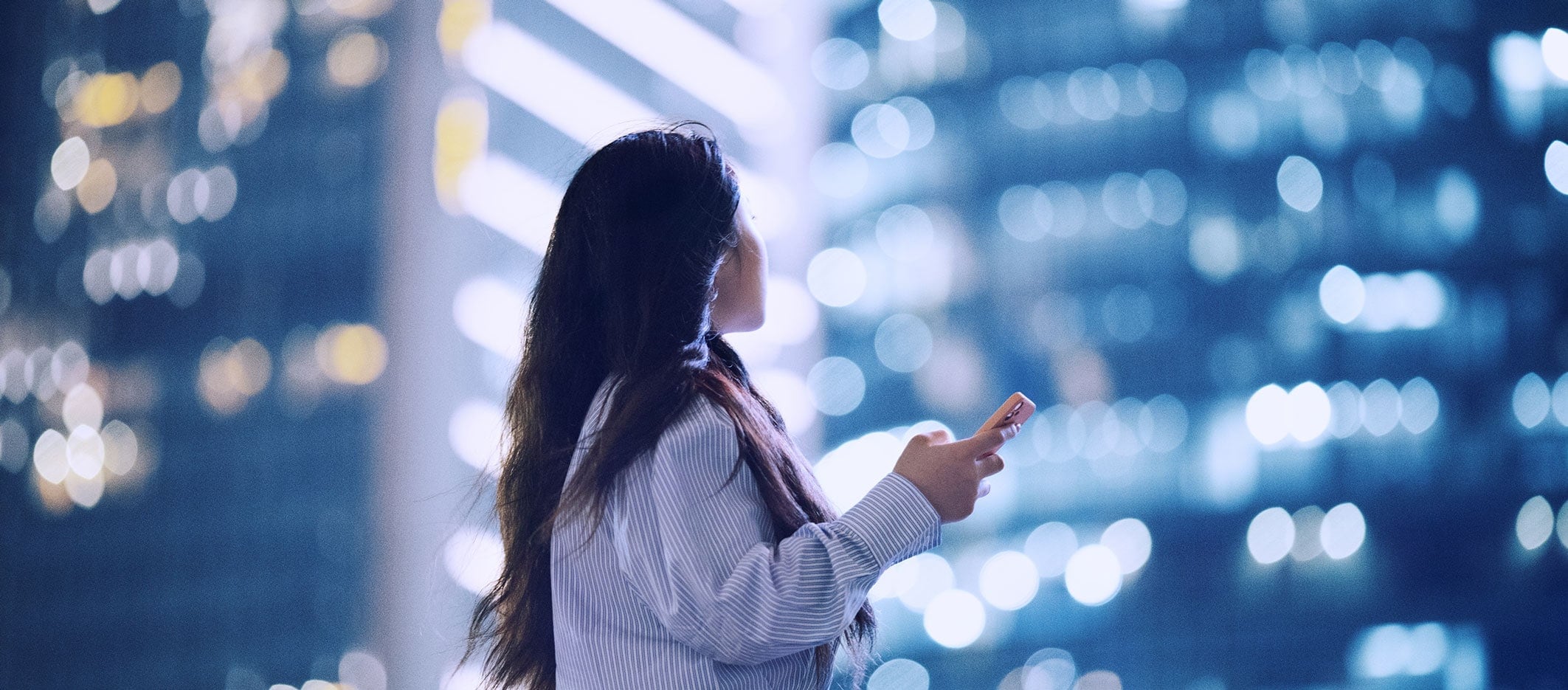 woman-surrounded-by-skyscrapers