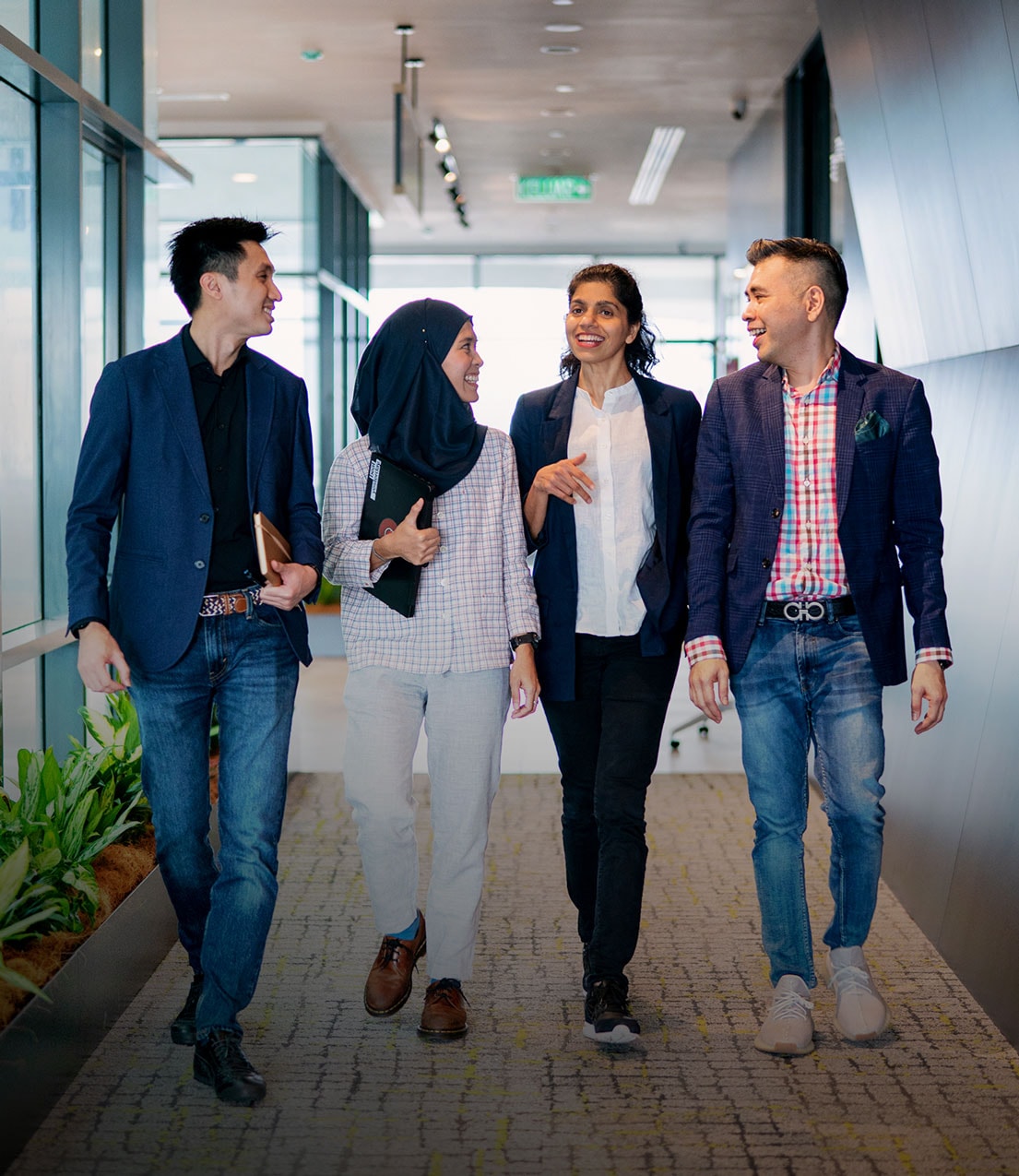 A group of colleagues walking together in an office