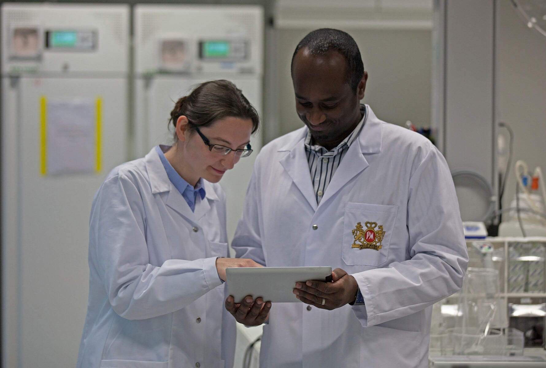 two-researchers-looking-at-tablet