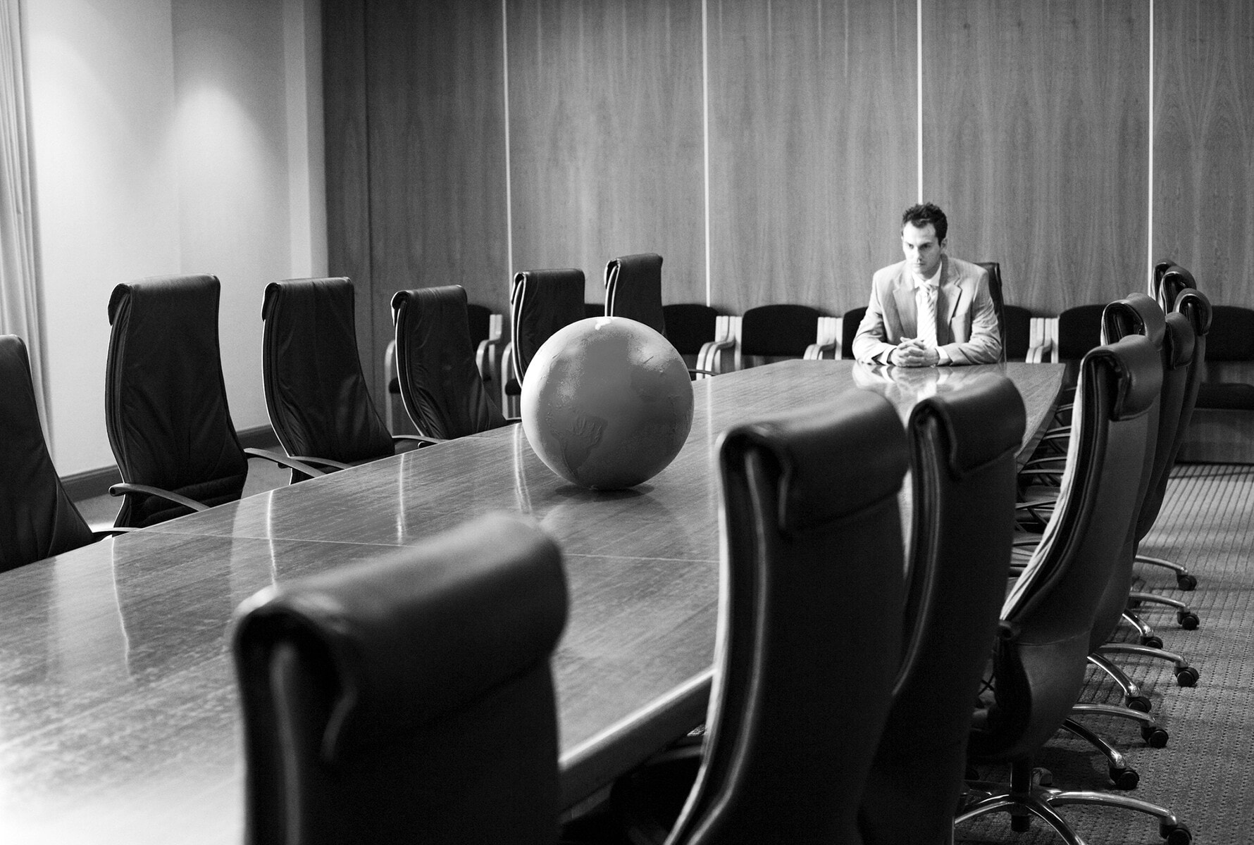 Man in empty meeting room UYM news 5-B&W