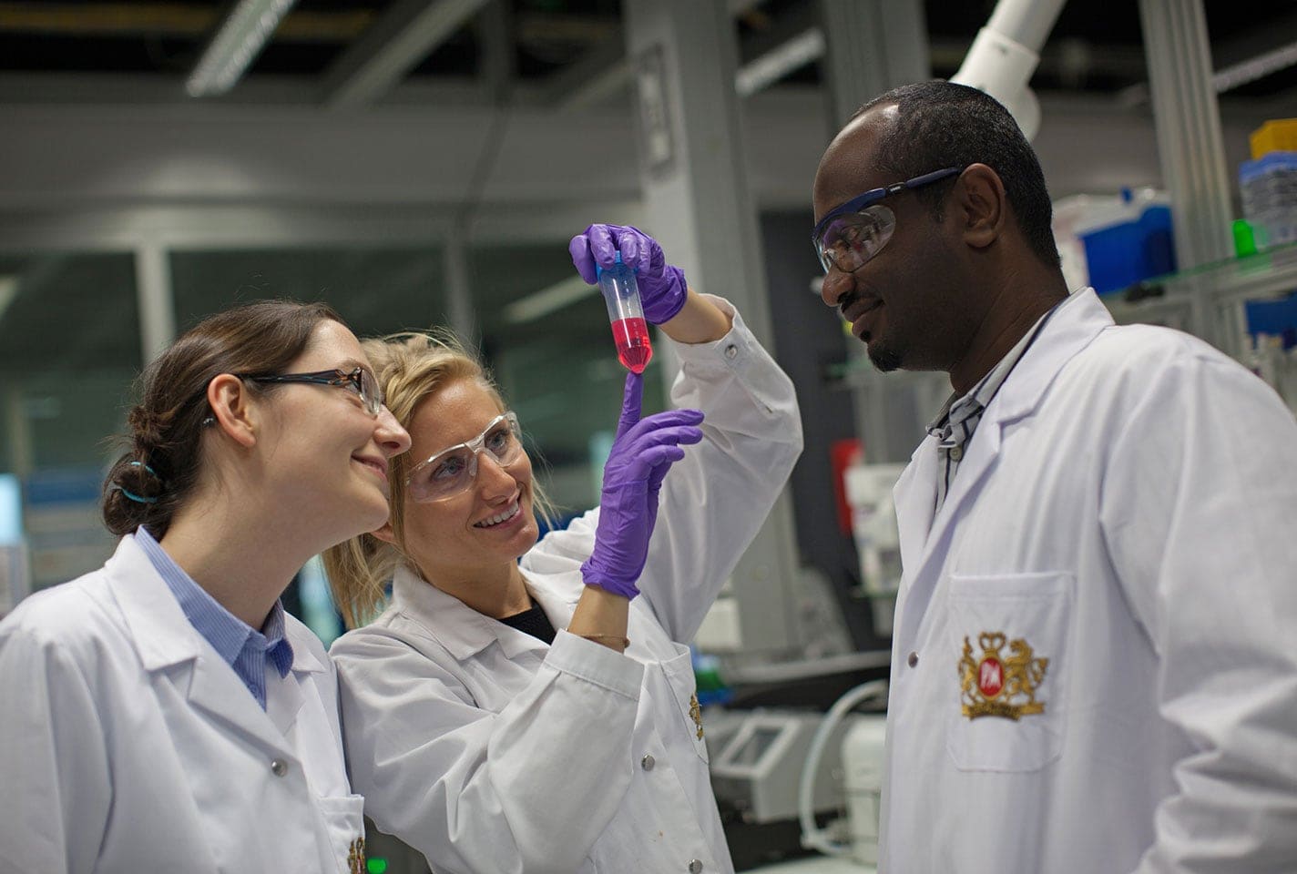 Diverse scientists in lab landscape