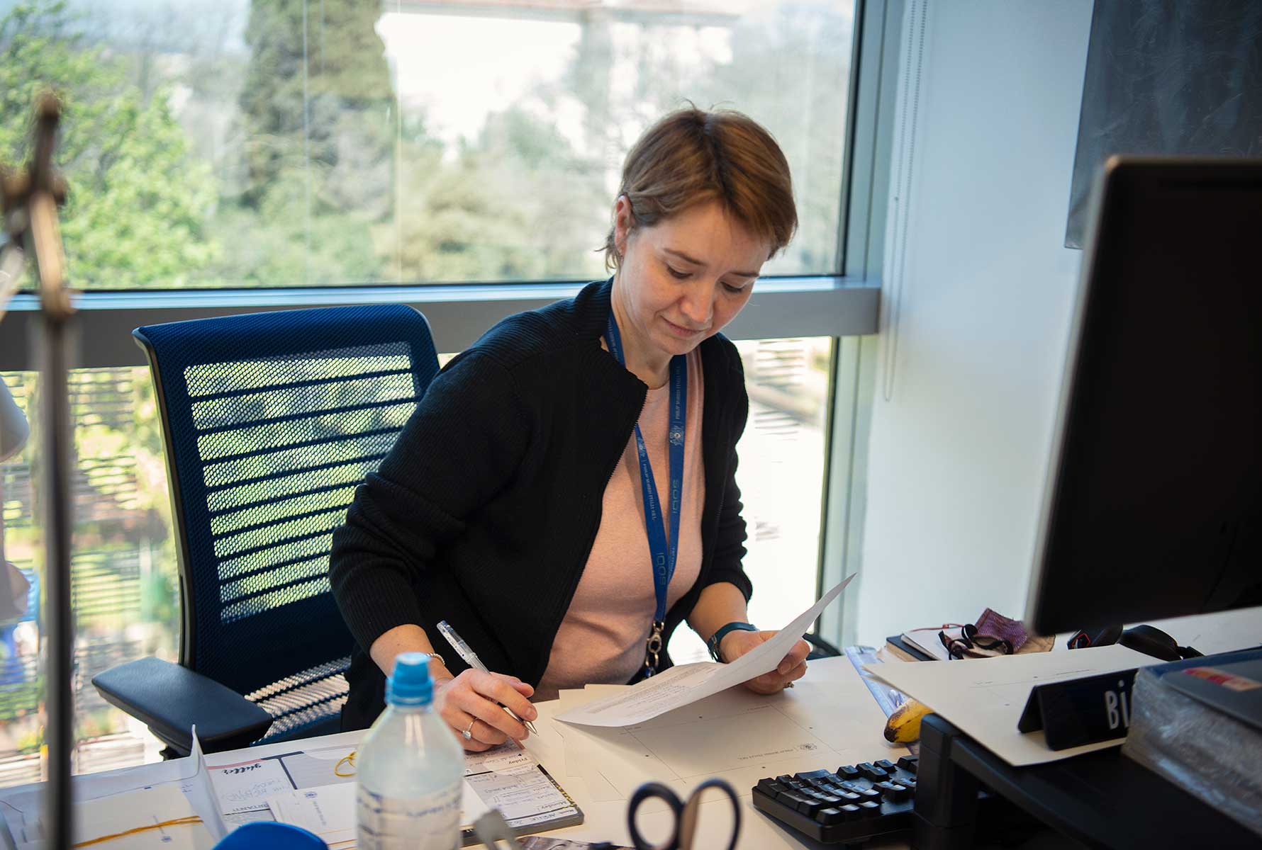 pmi-employee-sitting-at-desk
