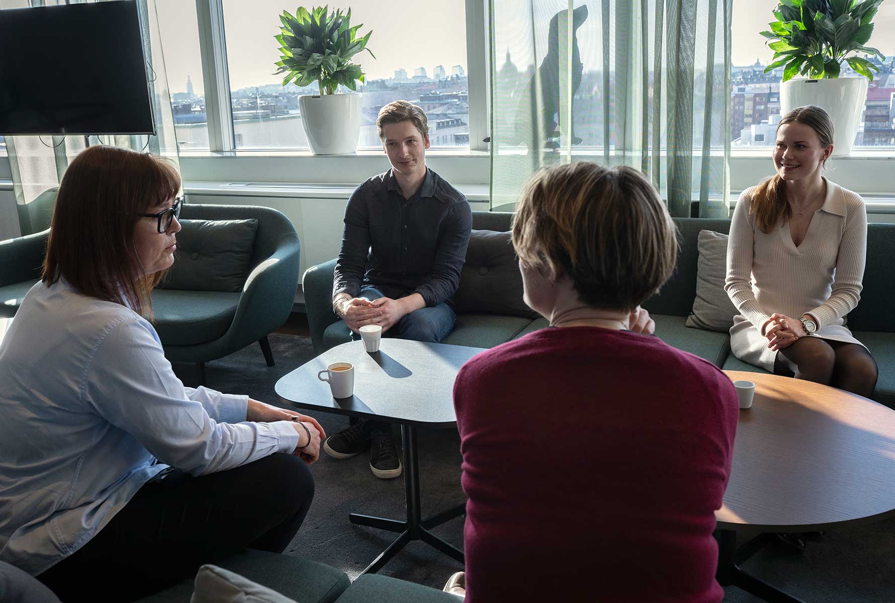 pmi-employees-sitting-with-coffee-cups