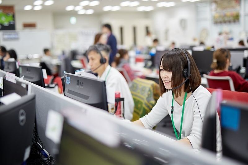 women with headset meeting