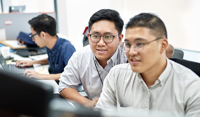 Two men at a computer thumbnail