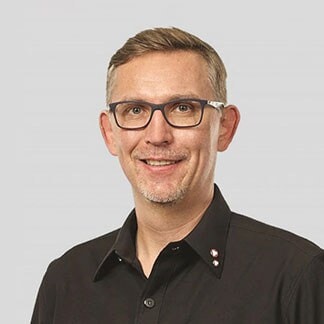 mindaugas-trumpaitis-headshot-grey-bckgr