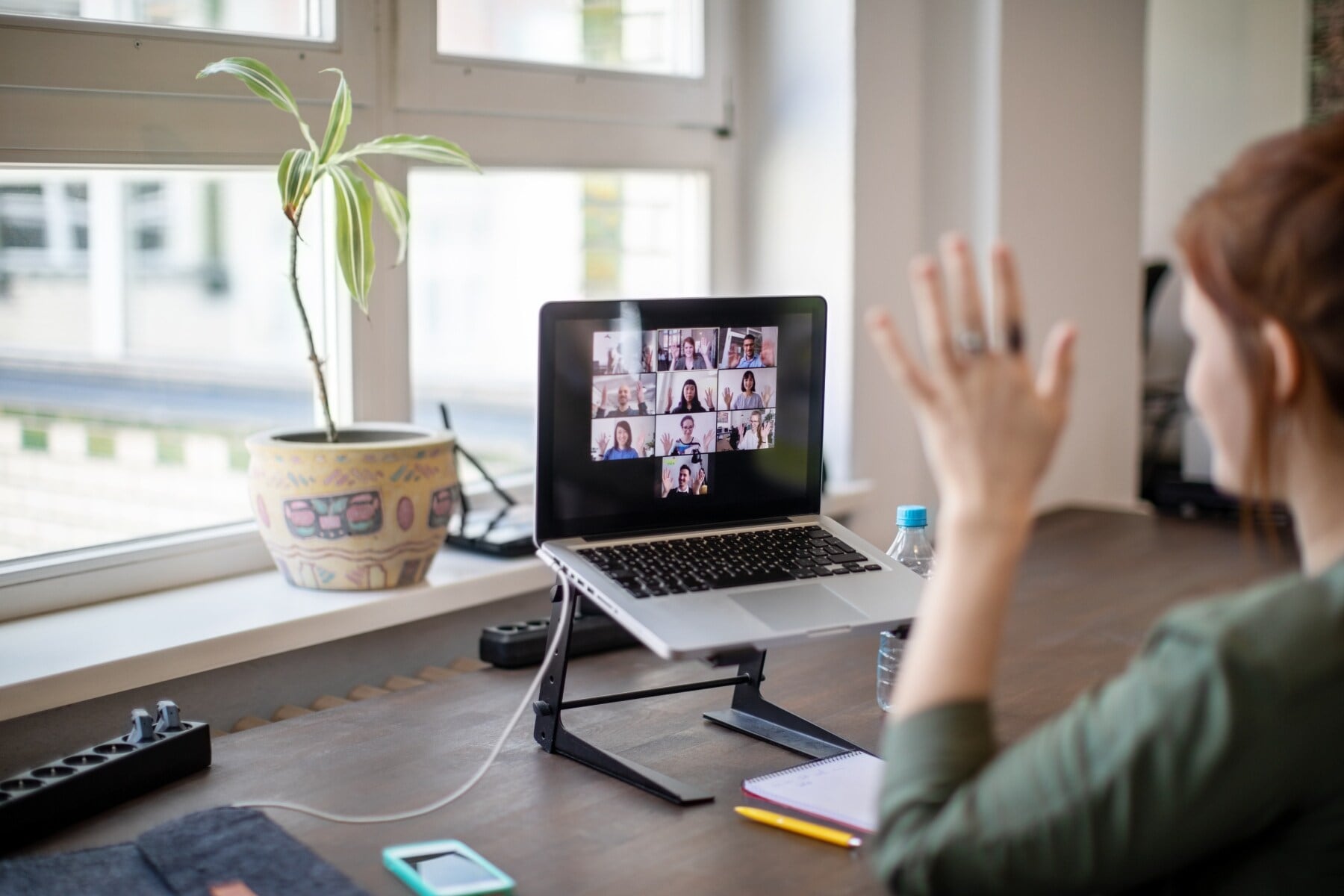 woman-waving-conference-call