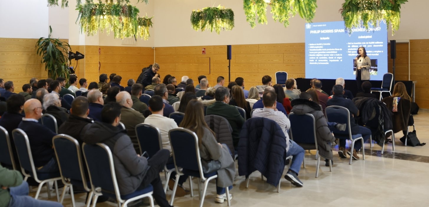 a group of people sitting and listening to a lecture