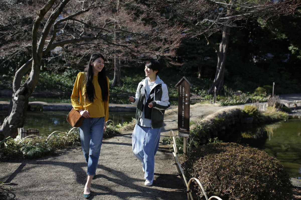 women-and-man-smiling-and-walking