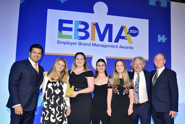 PMI team collecting award at EBMA Awards