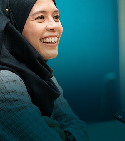 Smiling female employee at Philip Morris International