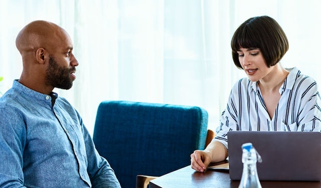 Man and woman in a meeting room