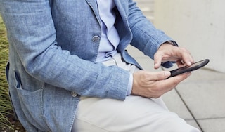 Man sitting outside using his phone