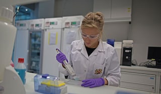 Female scientist in a Philip Morris International laboratory