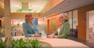 Two women talking in an office