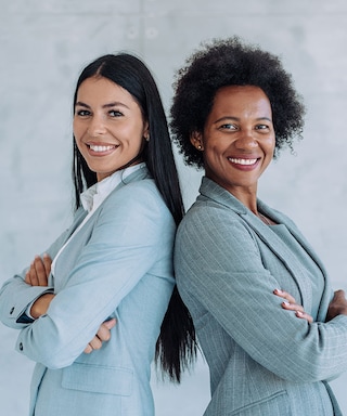 Two businesswomen smiling