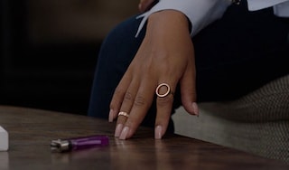 Woman's hands by a cigarette lighter