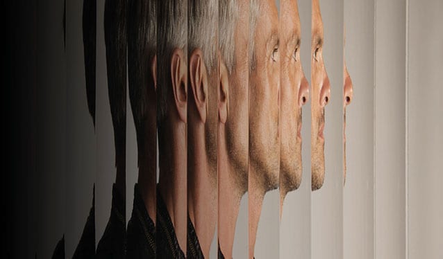 Man standing behind textured glass