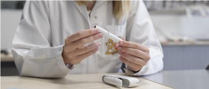 marketsite scientist with IQOS holder