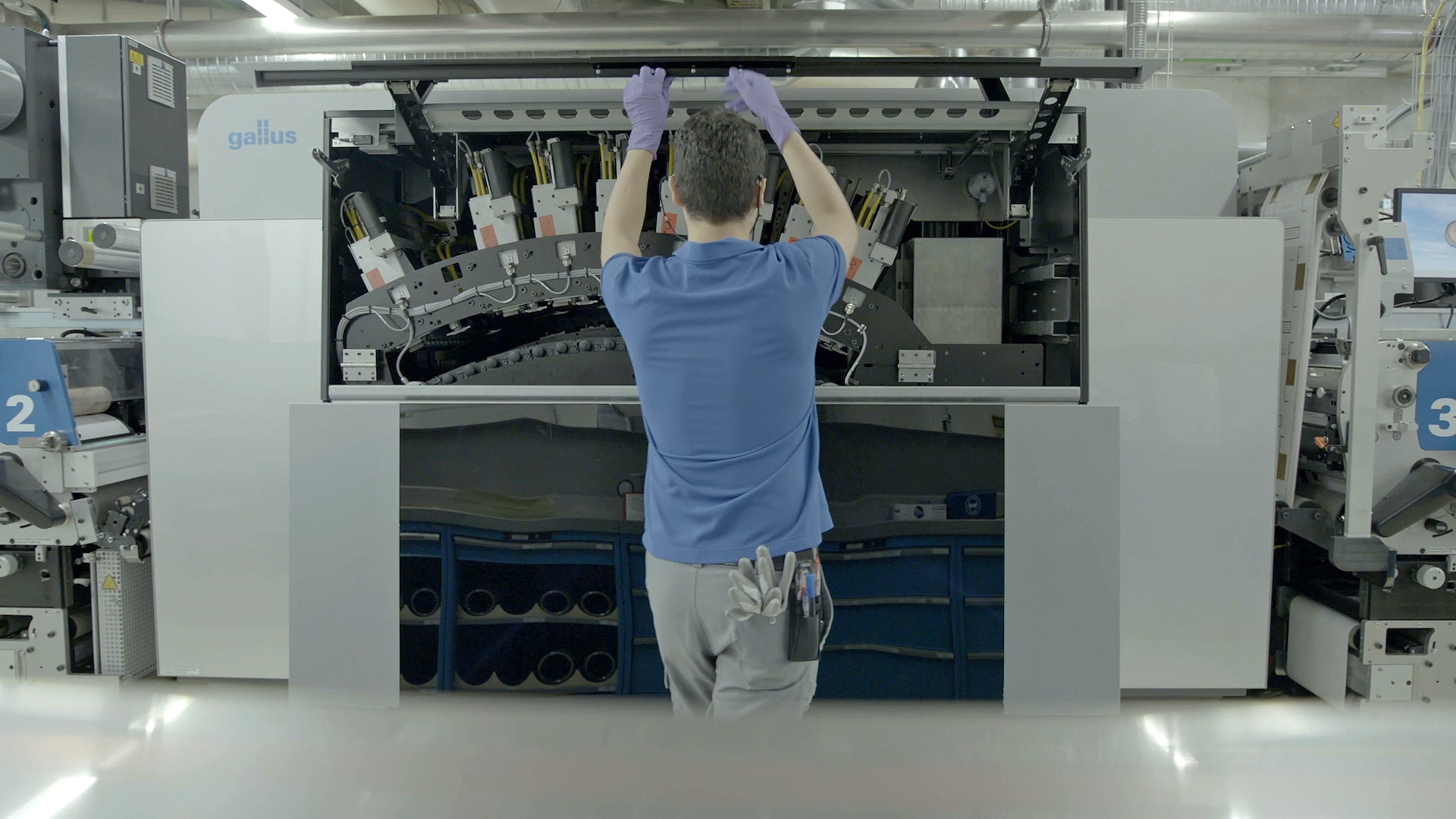 Worker in a factory using a digital printing press, Neuchatel