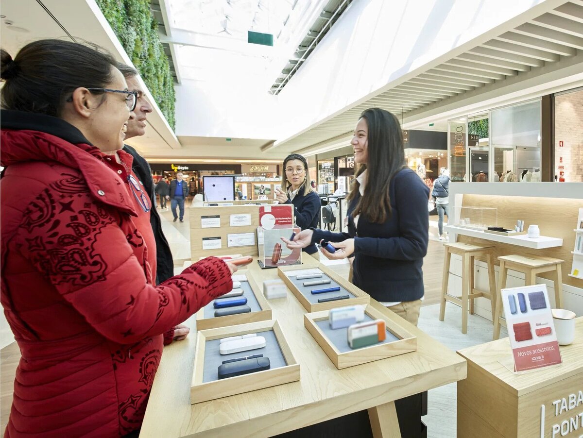 Customers at an IQOS pop-up store in Lisbon, Portugal.