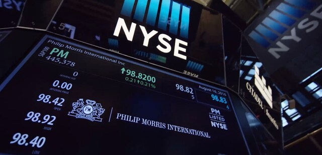 A screen showing the PMI stock price at the New York Stock Exchange.