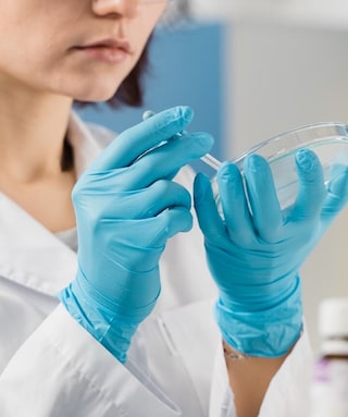 Female scientist holding a petri dish