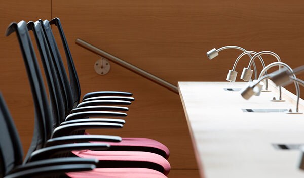 Empty chairs in an auditorium meeting