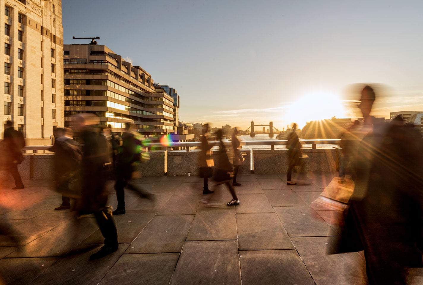 Commuters crossing London Bridge