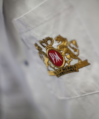 Philip Morris International logo on a lab coat pocket