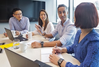 Workers in an office meeting