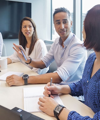 Malaysian employees in a team meeting