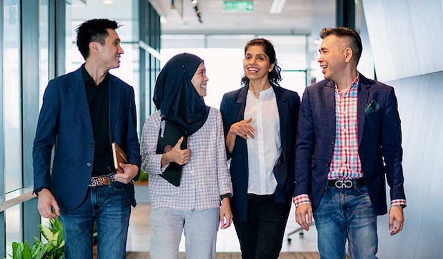 PMI employees walking in a corridor