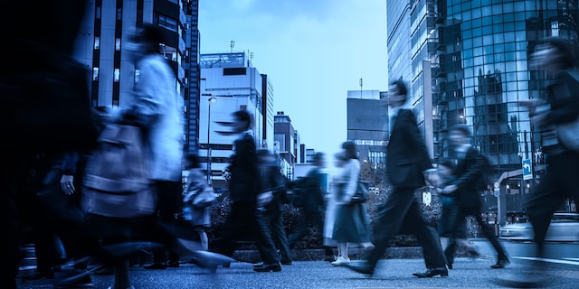 people walking down a busy street