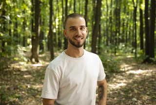 Smiling man in a forest