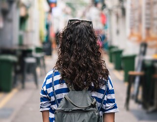 Young woman standing in a street