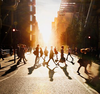 People crossing the street in a city