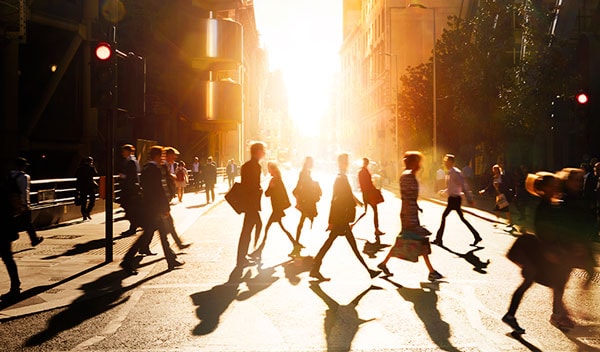 People crossing the street in a city