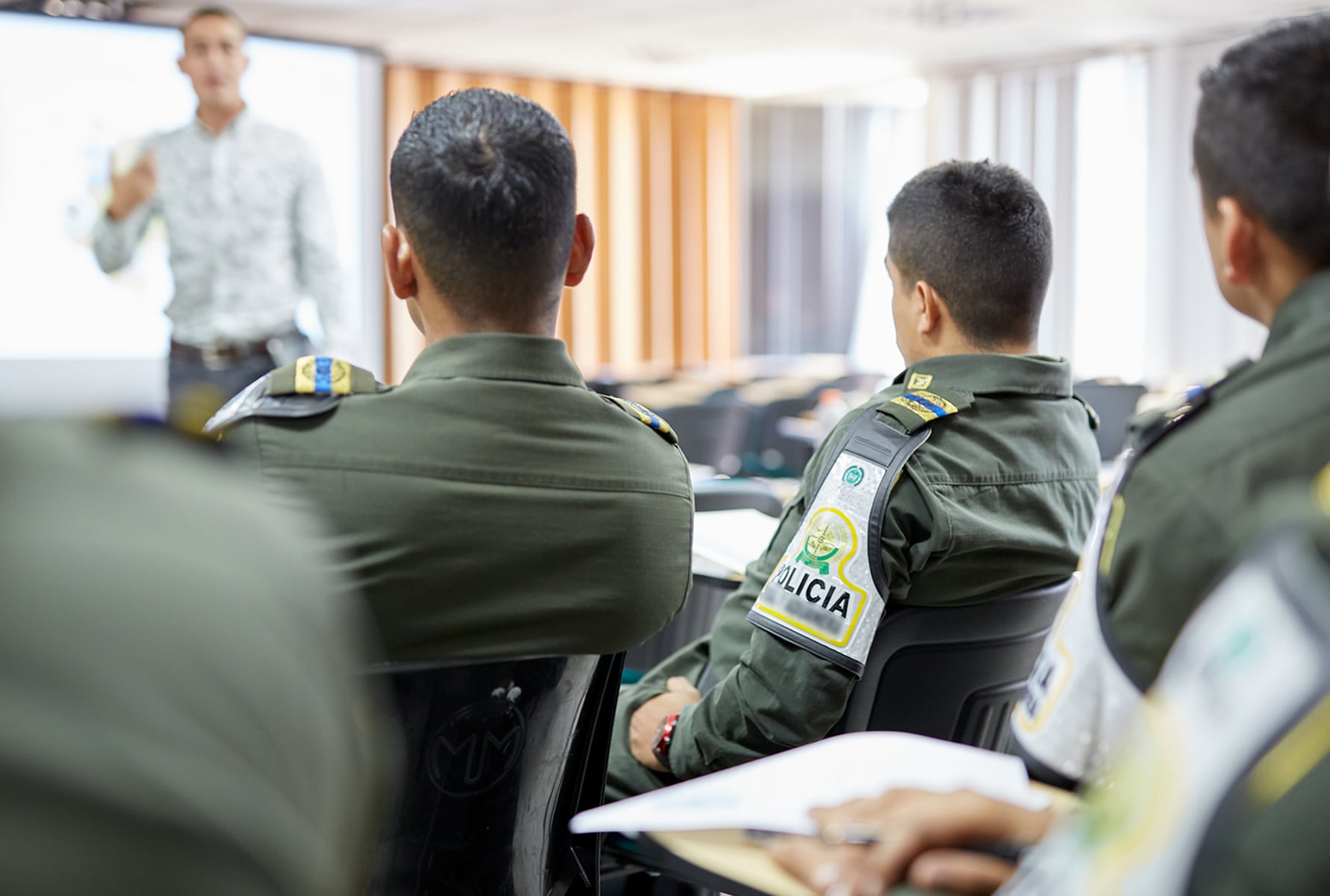 Police officers listening to a training about illicit trade in Colombia