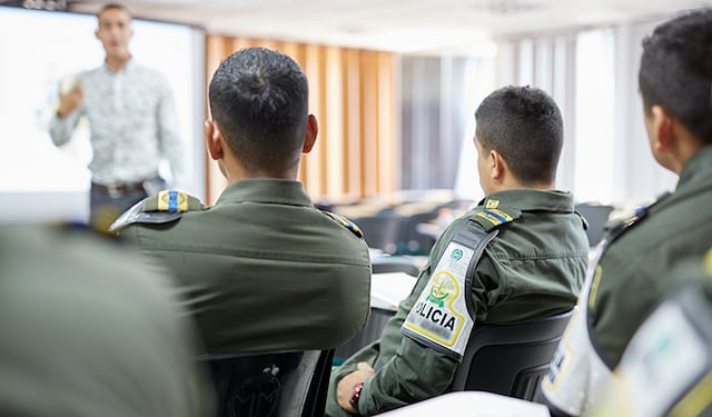 Police officers listening to a training about illicit trade in Colombia