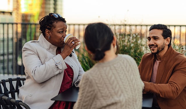 Friends talking on a terrace