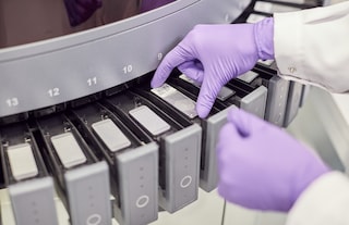 A close-up of a scientist’s hands in PMI’s R&D center in Neuchâtel, Switzerland.