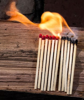 Burning matchsticks on a table