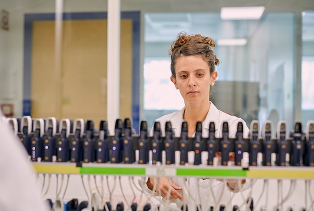 Female scientist in lab highlight crop
