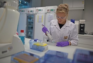 Female scientist in a Philip Morris International laboratory