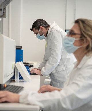 Male and female scientists in a labaratory