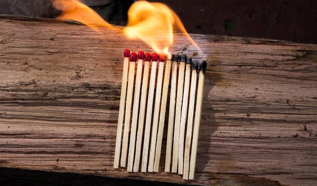 Burning matchsticks on a table