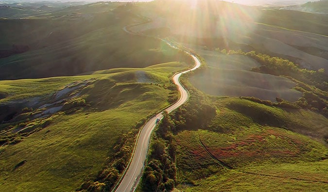Car winding through a country road