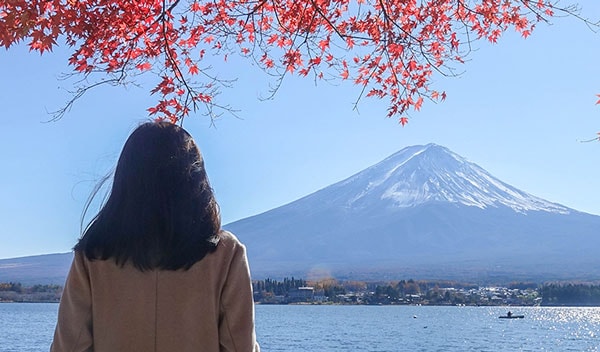 Woman looking at a mountain in Japan