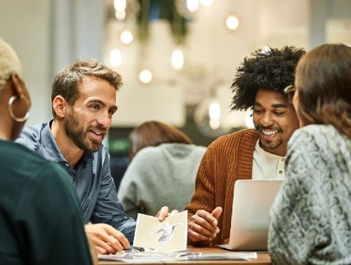 Group of friends talking at a table